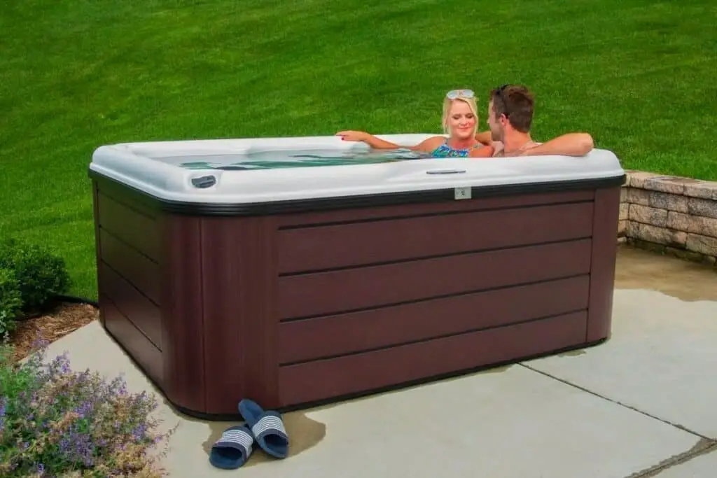 couple enjoying their nordic hot tub installation